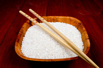 Rice in china cup with chopsticks