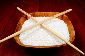Rice in china cup with chopsticks - obrazy, fototapety, plakaty