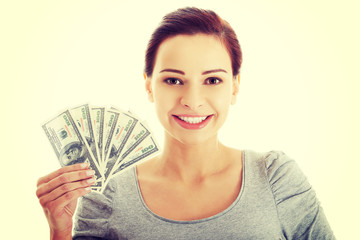 Young woman holding dollars.