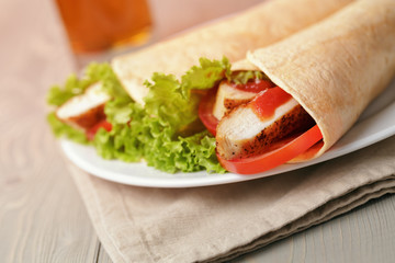 freshly made tortilla wraps with chicken and vegetables
