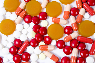 Many colorful pills isolated on white © rbadowski