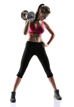 Athletic young woman doing a fitness workout with weights