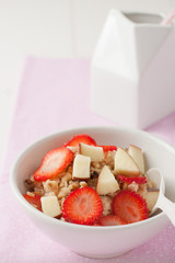 a bowl of oatmeal with fruit and nuts