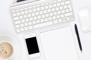 Office desk table with computer, supplies and coffee cup