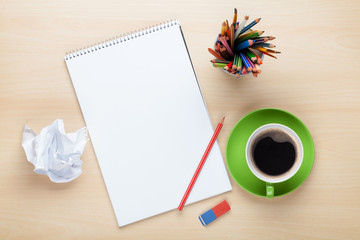 Office desk table with supplies and coffee cup