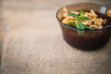 homemade jam with apricot walnuts on a rustic linen napkin