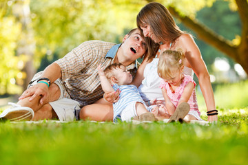 Naklejka na ściany i meble Happy Family Enjoying In The Park
