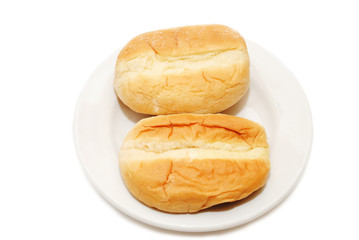 Two Dinner Rolls on a White Plate
