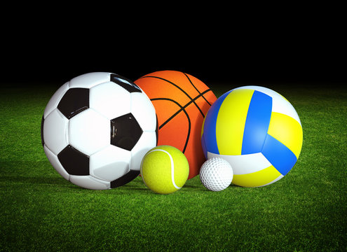 sports balls on grass