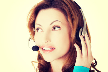 Smiling support phone operator in headset.
