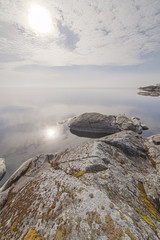 Rocky shore of the lake on a sunny day.
