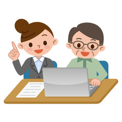 パソコンを使うシニアと教える先生
