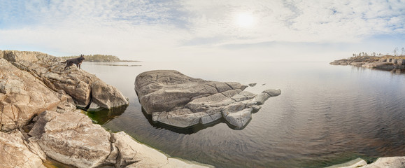 Rocky shore of the lake on a sunny day.