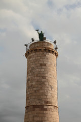 Column with Saint Fermina statue. Civitavecchia, Italy