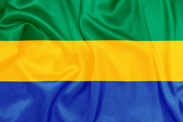 Gabon - Waving national flag on silk texture
