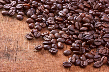 Coffee beans on wood background