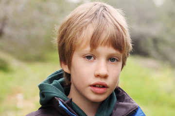 Outdoor portrait of 6 years old boy