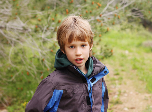 Outdoor portrait of 6 years old boy