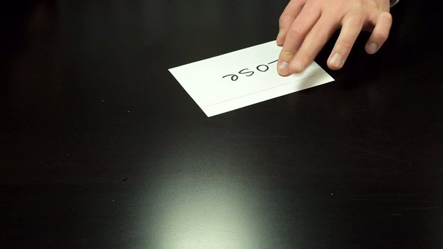 Man hands write the word Lose