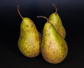 Green pears isolated from black background