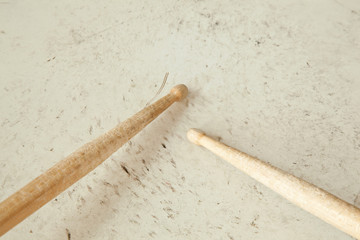 drumsticks on used drum
