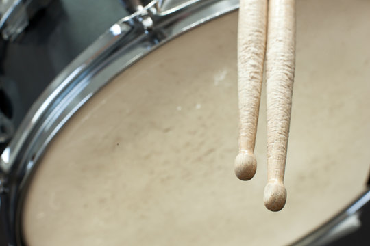 drumsticks and used drum