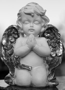 praying little angelic figurine