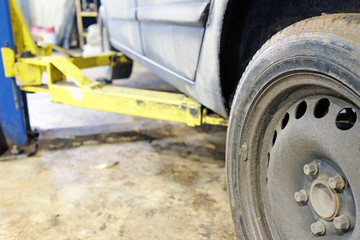 The image of details of lift in a car care garage