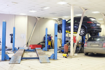 Image of a car repair garage with lift