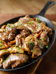 Liver baked with mushrooms, bacon and herbs
