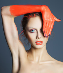 colorful portrait of beautiful woman with art creative make up.