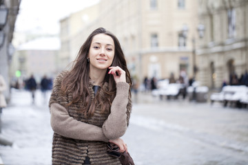 Fototapeta premium Young beautiful woman in stylish mink coat