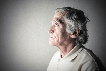 Elderly man remembering something