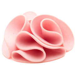 cooked boiled ham sausage or rolled bologna slices isolated on w © Natika