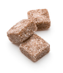 Brown lump cane sugar cube isolated on white background cutout