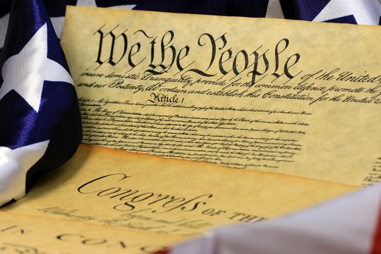 Historical Document US Constitution with America Flag