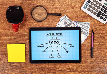 Naklejka premium tablet with seo scheme