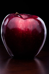 Gloss Red Apple on Dark Background