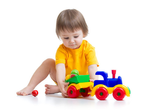 little boy toddler playing with toy