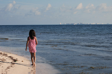 Girl walking at the beach