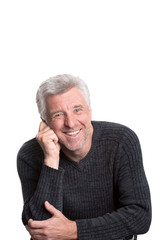 mature older man sitting  smiling