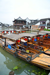 Old village by river in Shanghai with boat..