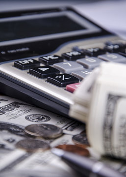 Closeup of US dollars and calculator