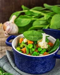 mix vegetables in a blue ceramic pot
