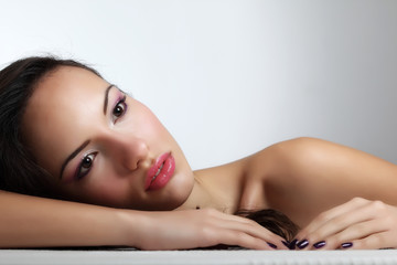 Obraz premium Portrait of young beautiful woman with fashion makeup
