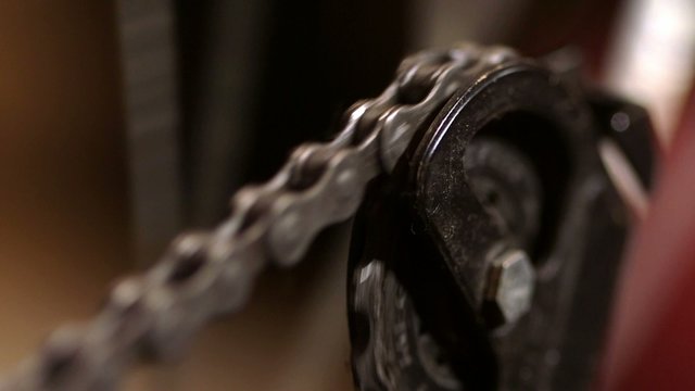 Dirty greasy gear chain linkage turning around in circle