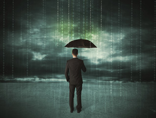Business man standing with umbrella data protection concept