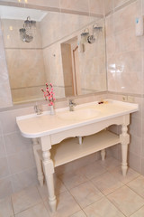 Bathroom interior fragment in light tones