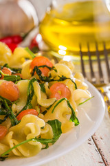 Pasta with grilled shrimp and arugula