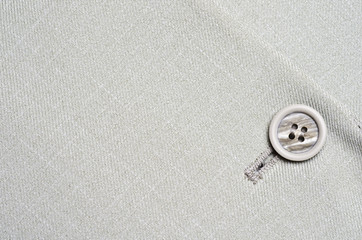 Fototapeta na wymiar grey button on jacket